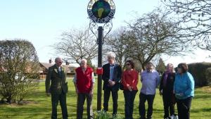 Several Parish notables at the unveiling of the refurbished Parish sign.