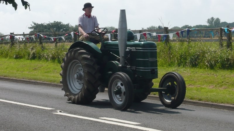 A vintage tractor on its way to an event at the recreation ground