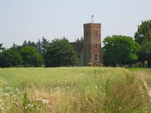 A picture of St Peters Carlton from across the fields at Carlton Park