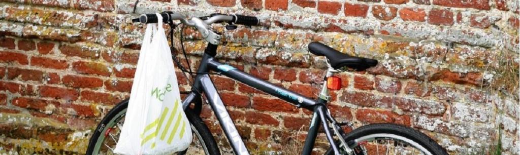 A bicycle leans against a church wall heralding the annual Ride and Stride around Suffolk's historic Churches